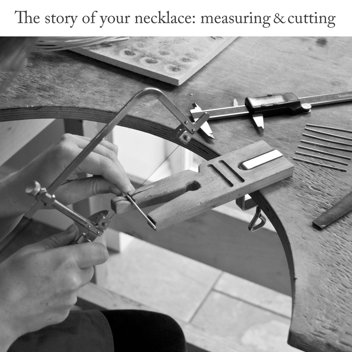 Close-up of silversmith using a pair of measuring callipers and a jewellers saw to cut several lengths of wire on a workbench with headline text 'The story of your necklace: measuring and cutting'