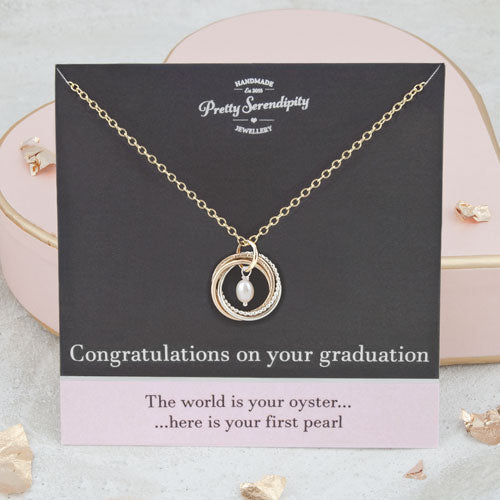 Graduation Necklace with Pearl on a gift card bearing the message 'The world is your oyster...here is your first pearl'
