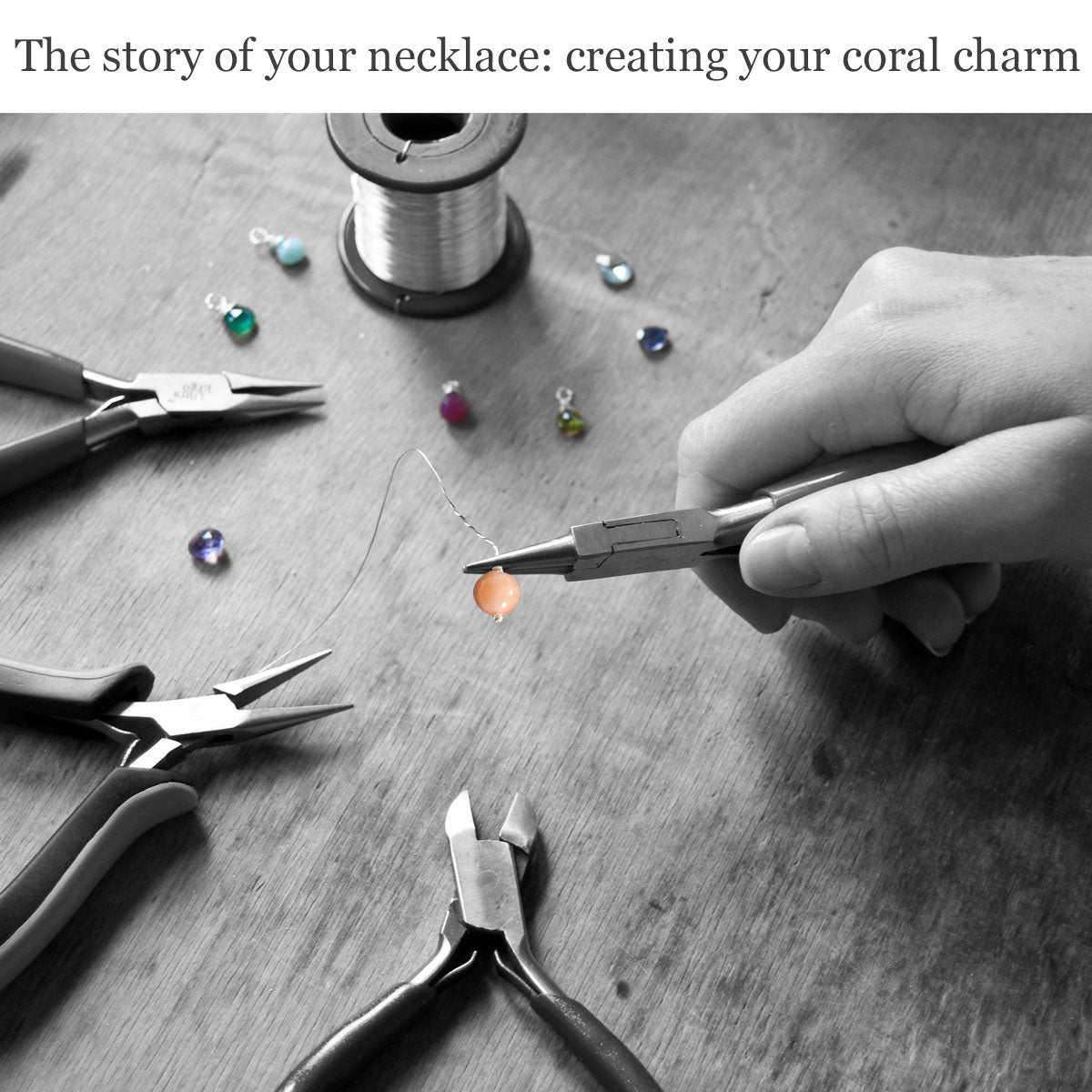 Handcrafting a coral charm with jewellery-making tools and wire on the wooden surface of a work bench