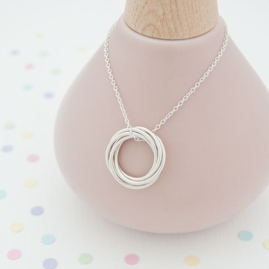 5 rings for 5 sales decades necklace